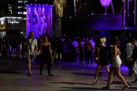 People walk outside a nightclub in Barcelona on June 26, 2021. (Photo | AFP)