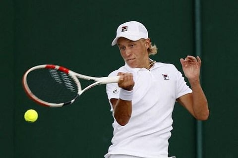 Sweden's Leo Borg returns against Serbia's Marko Topo during their men's singles fourth round match on the seventh day of the 2021 Wimbledon Championships. (Photo | AFP)