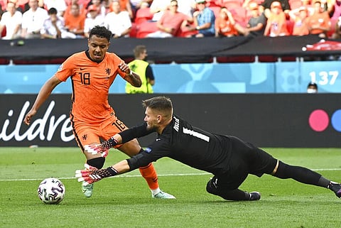 Donyell Malen of the Netherlands, left, challenges for the ball with Czech Republic's goalkeeper Tomas Vaclik during the Euro 2020. (Photo | AP)