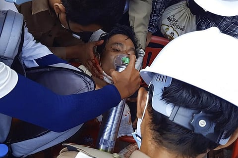 FILE | Image from video provided by Dakkhina Insight, medics attend to a man who appeared to be wounded in his upper chest on a street in Dawei, Myanmar. (Photo | AP)