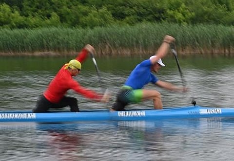 Catalin Chirila (R), 23, and Victor Mihalachi (L) are pictured during during a training session at the Snagov nautical base (30 km north of Bucharest). (Photo | AFP)