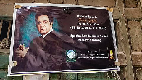 A condolence banner put up by Directorate of Archaeology and Museums, Govt. of Khyber Pakhtunkhwa, at the ancestral house of legendary Dilip Kumar on his demise. (Photo | PTI)