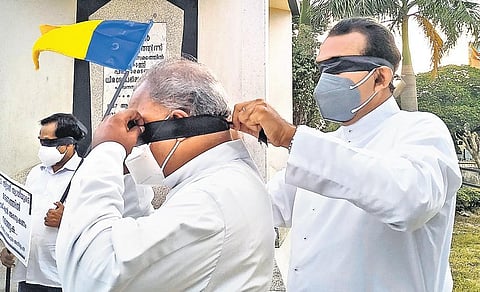 Priests belonging to the Latin Archdiocese of Thiruvananthapuram blindfolding themselves as part of a protest seeking a inquiry into death of Fr Stan Swamy, at Martyrs Column, Palayam | BP Deepu
