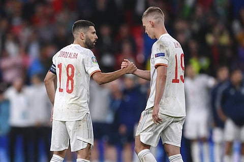 Spain's Jordi Alba, left, comforts Dani Olmo during the Euro 2020 soccer semifinal match between Italy and Spain at Wembley stadium. (Photo | AP)
