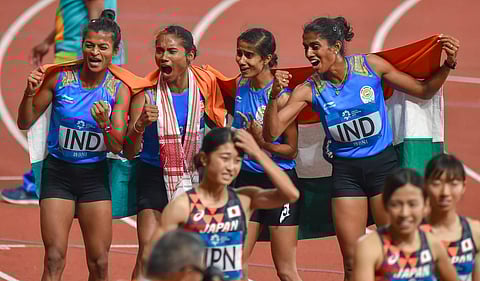 FILE | Gold medallists Sarita Gayakwad, Hima Das, Vismaya and Poovamma Raju celebrate after the women's 4x400m relay event at the Asian Games. (Photo | PTI)