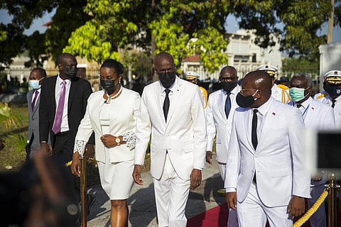 In this May 18, 2021 file photo, Haitian President Jovenel Moise, center, walks with first lady Martine Moise, left, and interim Prime Minister Claude Joseph, right, during a ceremony. (Photo | AP)