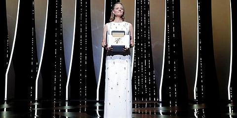 Jodie Foster poses with her honorary Palme d'Or at the opening ceremony of the 74th international film festival, Cannes, southern France, Tuesday, July 6, 2021. (Photo | AP)