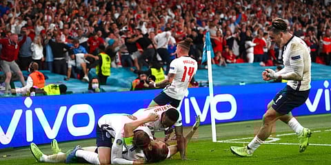 England's Harry Kane, bottom, celebrates with his teammates after scoring his side's second goal against Denmark in Euro semifinal. (Photo | AP)