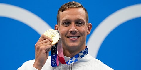 Caeleb Dressel, of United States, poses after winning the gold medal in the men's 50-meter freestyle final at the 2020 Summer Olympics in Tokyo, Japan. (Photo | AP)