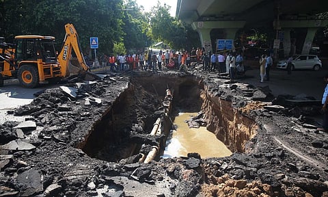 A portion of a road that caved in near IIT flyover, in New Delhi. (Photo | EPS)