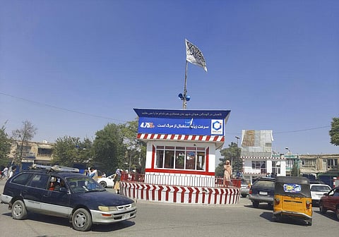 A Taliban flag flies in the main square of Kunduz city after fighting between Taliban and Afghan security forces, in Kunduz, Afghanistan. (File Photo | AP)