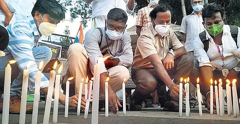 Journalists lighting candles protesting against the attack on ‘Siraj’ photojournalist T Sivajikumar by a group of lawyers on the Vanchiyoor court premises on Monday | BP Deepu