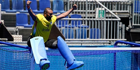 India goalkeeper PR Sreejesh reacts while sitting on the goal after India defeated Germany 5-4 during the men's field hockey bronze medal match at the 2020 Summer Olympics in Tokyo. (Photo | AP)