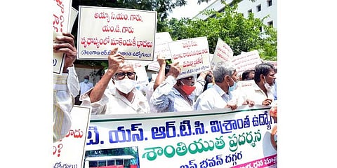 Retired TSRTC employees stage a protest near Bus Bhavan in Hyderabad on Monday. (Photo | RVK Rao)