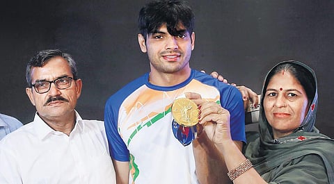 Neeraj Chopra with his parents at a felicitation ceremony in New Delhi on Tuesday | shekhar yadav