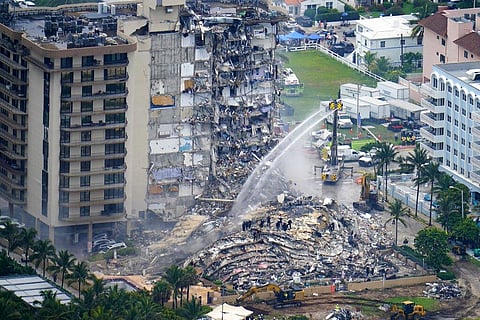 In this June 25, 2021, file photo, rescue personnel work at the remains of the Champlain Towers South condo building. (Photo | AP)