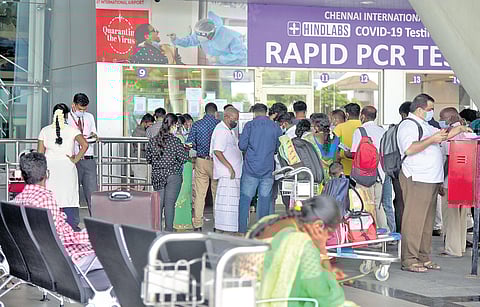 Covid norms go for a toss as people wait at an RT-PCR laboratory at Chennai International Airport on Thursday. (Photo | Martin Louis/EPS)