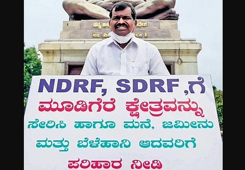 MLA MP Kumaraswamy protests at Vidhana Soudha in Bengaluru on Thursday  