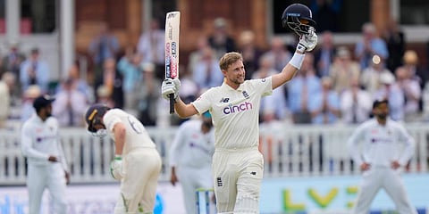 England's Joe Root celebrates after scoring 100 runs not out during the third day of the 2nd cricket test between England and India at Lord's cricket ground in London. (Photo | AP)