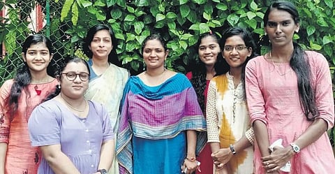 Rankholders of BA Philosophy exam conducted by Kerala University with their professors