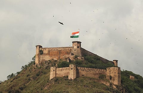 A giant Indian national flag flies over the historic Hari Parbat fort on Independence Day in Srinagar. (Photo | AP)