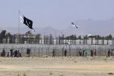 Stranded people cross the border between Pakistan and Afghanistan, in Chaman, Pakistan. (Photo | AP)