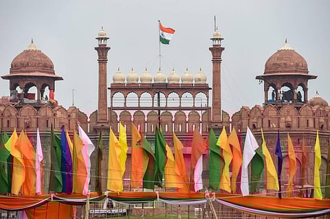 Indian national flag flutters atop the historic Red Fort on the eve of Independence Day in New Delhi. (File Photo | PTI)