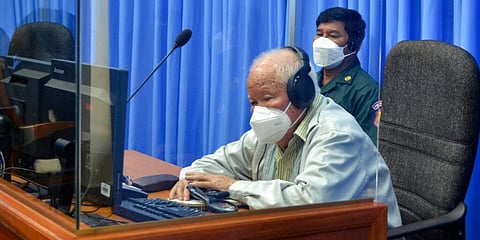 Khieu Samphan, foreground, former Khmer Rouge head of state, sits in a courtroom during a hearing at the U.N.-backed war crimes tribunal in Phnom Penh, Cambodia, Monday, Aug. 16, 2021. (Photo | AP)