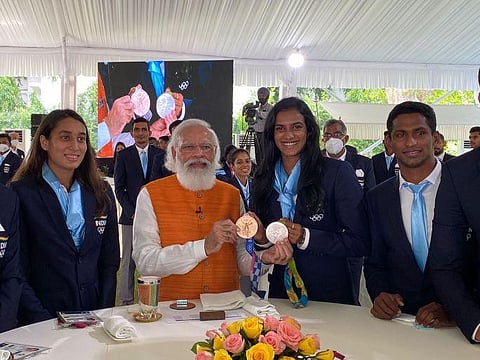 PM Modi with India's Tokyo Olympics contingent. (Photo | Twitter)