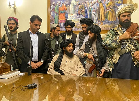 Taliban fighters take control of Afghan presidential palace after the Afghan President Ashraf Ghani fled the country, in Kabul, Afghanistan, Sunday, Aug. 15, 2021. (Photo | AP)