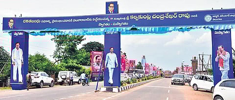 Banners with Chief Minister K Chandrasekhar Rao’s photographs dot the Shalapalli-Indiranagar Road in Huzurabad. (Photo | Express)