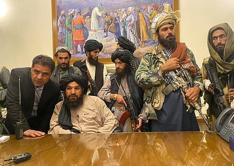 Taliban fighters take control of Afghan presidential palace after the president Ashraf Ghani fled the country, in Kabul on Sunday. (Photo | AP)