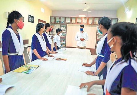 5T secretary VK Pandian interacts with students at a school. (Photo | EPS)