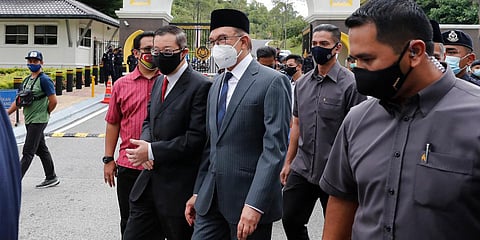 Malaysia opposition leaders Anwar Ibrahim (C) and Lim Guan Eng (L) leave National Palace after meeting the King in Kuala Lumpur. (Photo| AP)