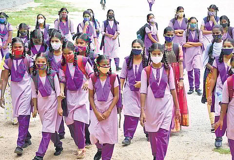 Students rush to attend their first physical class in months in Tirupati. (Photo | Madhav K, EPS)