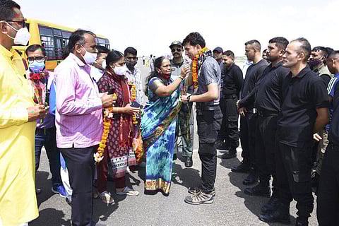 This photograph provided by Gujarat State Information Office shows, officials welcome Kabul Indian embassy staff members on their arrival at the Air force base, in Jamnagar. (Photo | AP)