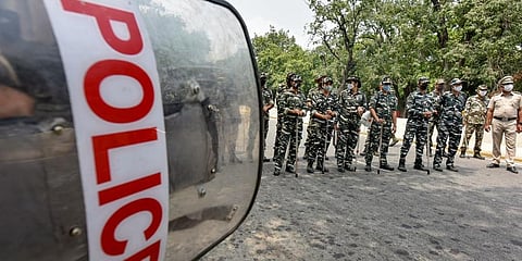 Security personnel stand guard during a protest by Delhi BJP members against vandalisation of Maharaja Ranjit Singh's statue in Lahore, outside the Pakistan High Commission, in Delhi. (Photo | PTI)