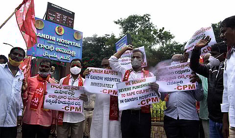 CPM members stage protest in front of Hyderabad's Gandhi hospital condemning the gang rape of two sisters that took place inside the hospital premises. (Photo | S Senbagapandiyan, EPS)