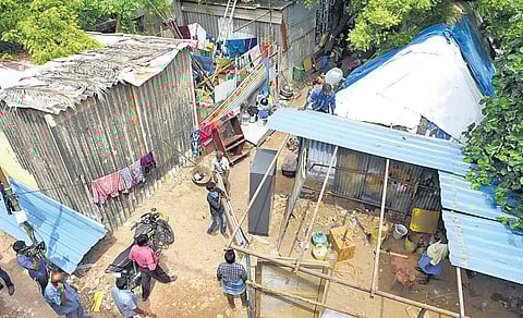 Encroachments being removed near the Cooum river at Arumbakkam. (Photo | R Satish Babu, EPS)