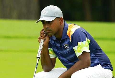 India's Anirban Lahiri studies his putt on the fourth green during the first round of the men's golf event at the 2020 Summer Olympics on Wednesday. (Photo | AP)