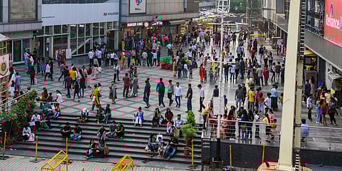 People throng V3S Mall after the relaxation in COVID-19 restrictions, at Nirmal Vihar, in New Delhi. (File photo| ANI)