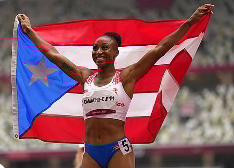 Jasmine Camacho-Quinn, of Puerto Rico celebrates after winning the gold in the women's 100-meters hurdles final at the 2020 Summer Olympics. (Photo | AP)