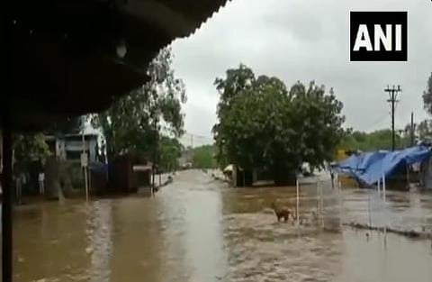 Nearly 60 people, who were stranded in a flooded building located near the Vijaypur bus stand in Sheopur district following heavy rains, were rescued after over seven hours by this noon. (Photo | ANI)