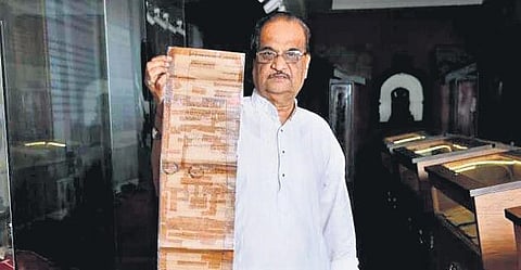 Working president of the Lokmanya Library and Museum with a damaged document | Express