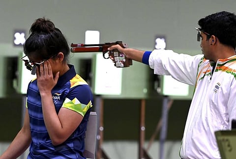 India's Manu Bhaker and Saurabh Chaudhary during the 10m Air Pistol Mixed Team shooting event, at the Summer Olympics 2020. (Photo | PTI)