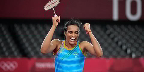 PV Sindhu celebrates a point against He Bing Jiao of China during thewomen's singles badminton bronze medal match at the 2020 Olympics. (Photo| AP)