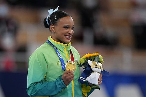 Rebeca Andrade of Brazil, poses after winning the gold medal in vault during the artistic gymnastics women's apparatus final at the 2020 Summer Olympics. (Photo | AP)