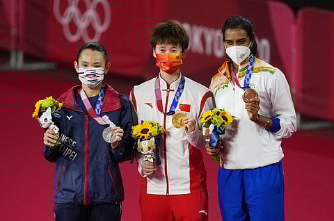 From Left, Silver medalist Taiwan's Tai Tzu-Ying, Gold medalist China's Chen Yu Fei and Bronze medalist Pusarla V. Sindhu celebrate during the medal ceremony. (Photo | AP)