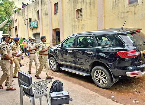 Police at the scene where Rahul’s body was found in an SUV. (Photo | Prasant Madugula)