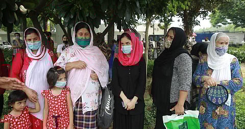 Afghan people outside the US Embassy in New Delhi on Thursday. (Photo | Shekhar Yadav, EPS)